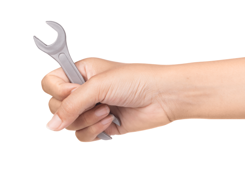 hand holding wrench isolated white background